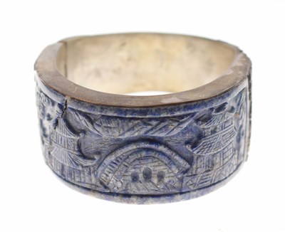 Lot 123 - Chinese white metal and carved lapis bangle
