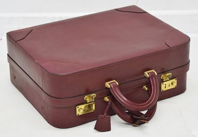 Lot 425 - Laurence Torino Italian claret-coloured leather suitcase