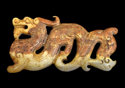 Lot 237 - Chinese celadon and russet jade 'dragon and phoenix' pendant