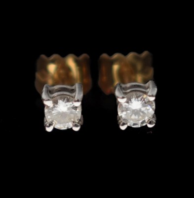 Lot 134 - Pair of diamond single stone 18ct gold ear studs