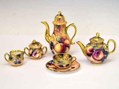 Lot 224 - Royal Worcester - Fruit painted six-piece miniature tea and coffee set