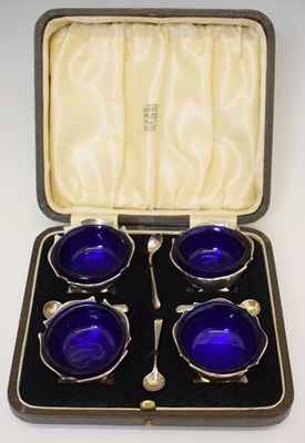 Lot 216 - Cased set of four Edward VII silver table salts with spoons