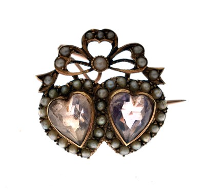 Lot 36 - Edwardian amethyst and seed pearl double-heart sweetheart brooch
