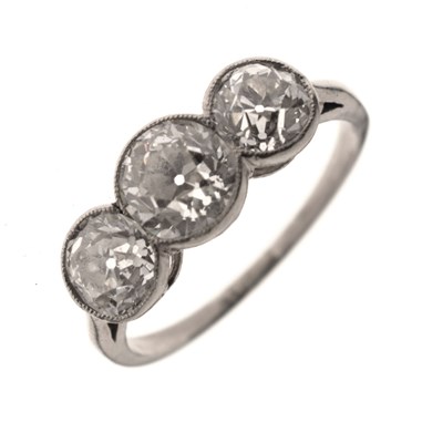Lot 9 - Early 20th century diamond three stone white metal ring