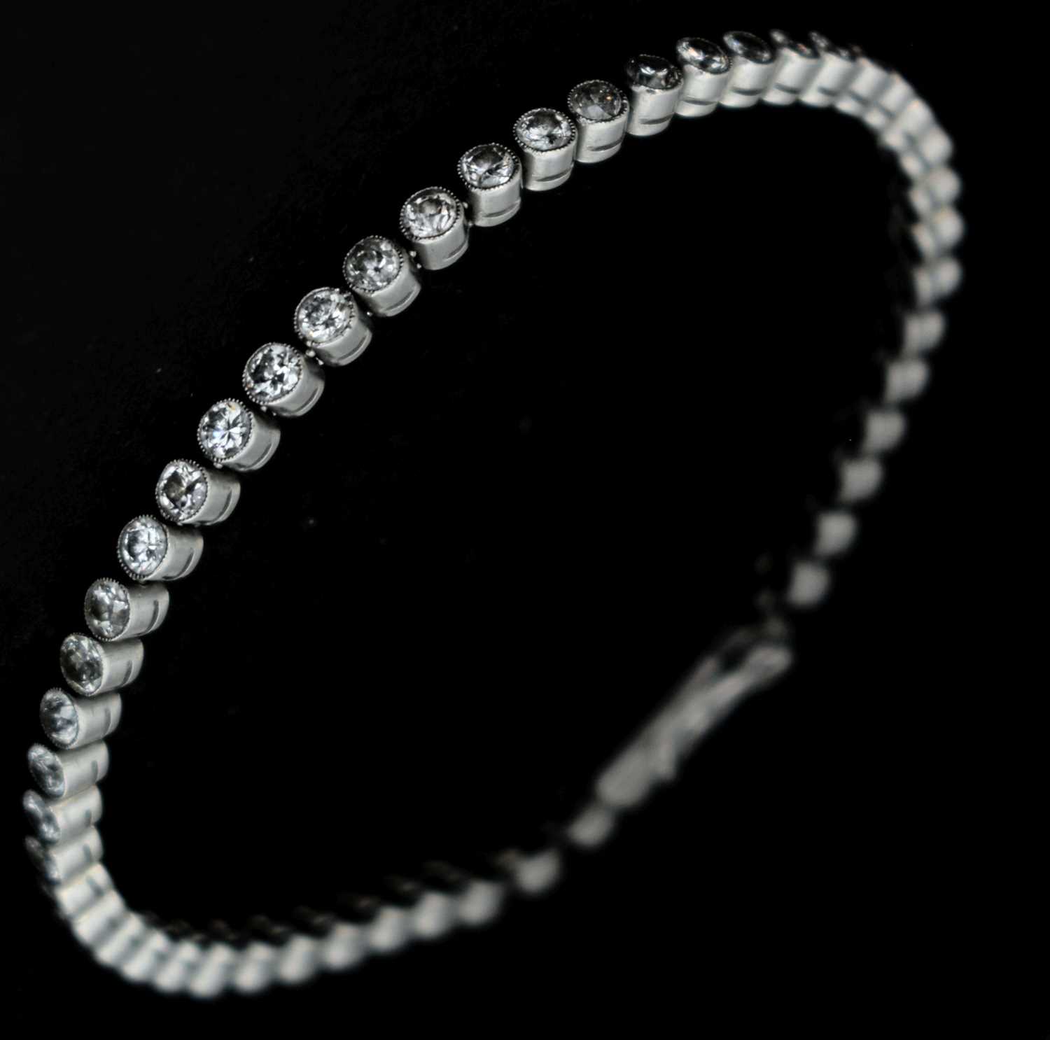 Lot 51 - Early 20th century diamond white metal line bracelet