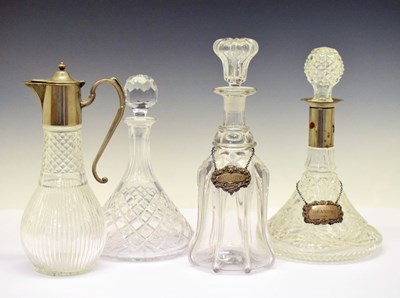 Lot 336 - Two silver decanter labels, London 1972 and 1973, claret jug, decanters, etc