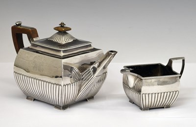 Lot 99 - George III silver two-piece tea set