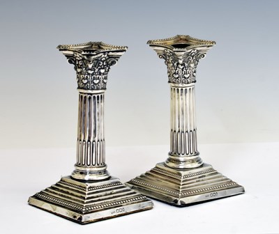Lot 97 - Pair of late Victorian silver candlesticks of Corinthian column form