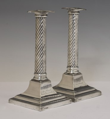 Lot 98 - Pair of George V silver candlesticks of spiral column form