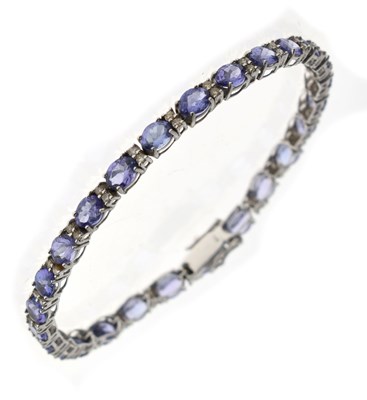 Lot 52 - Tanzanite and diamond bracelet white metal (stamped 18K) bracelet