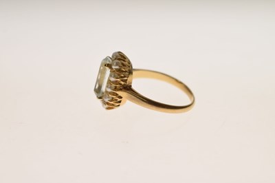 Lot 22 - Aquamarine and seed pearl unmarked yellow metal ring