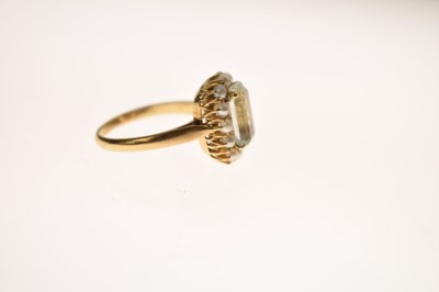 Lot 22 - Aquamarine and seed pearl unmarked yellow metal ring