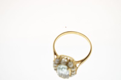 Lot 22 - Aquamarine and seed pearl unmarked yellow metal ring