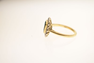 Lot 21 - Emerald and diamond 18ct yellow and white gold set cluster ring
