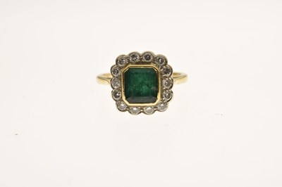 Lot 21 - Emerald and diamond 18ct yellow and white gold set cluster ring