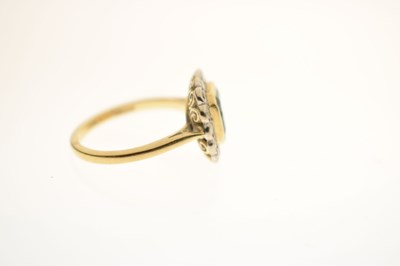 Lot 21 - Emerald and diamond 18ct yellow and white gold set cluster ring