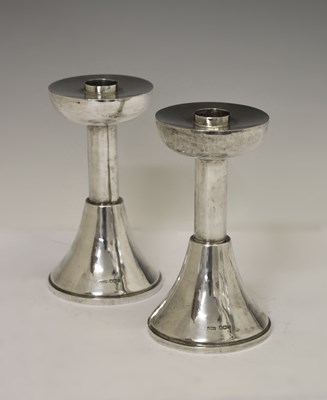 Lot 121 - Pair of Elizabeth II Arts & Crafts style silver candlesticks