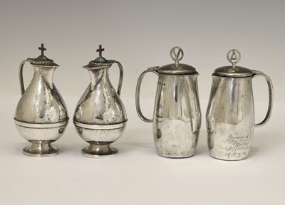 Lot 122 - Two pairs of Elizabeth II silver communion wine and water cruets
