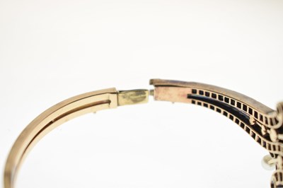 Lot 34 - Late 19th / early 20th century diamond and pearl hinged bangle