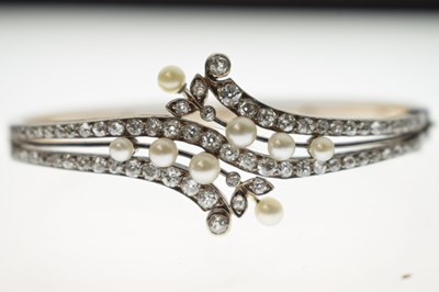 Lot 34 - Late 19th / early 20th century diamond and pearl hinged bangle