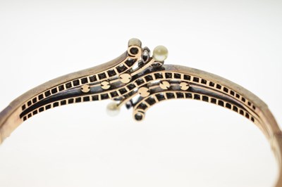 Lot 34 - Late 19th / early 20th century diamond and pearl hinged bangle