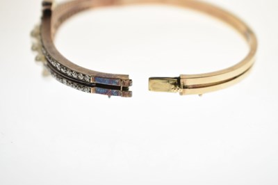 Lot 34 - Late 19th / early 20th century diamond and pearl hinged bangle