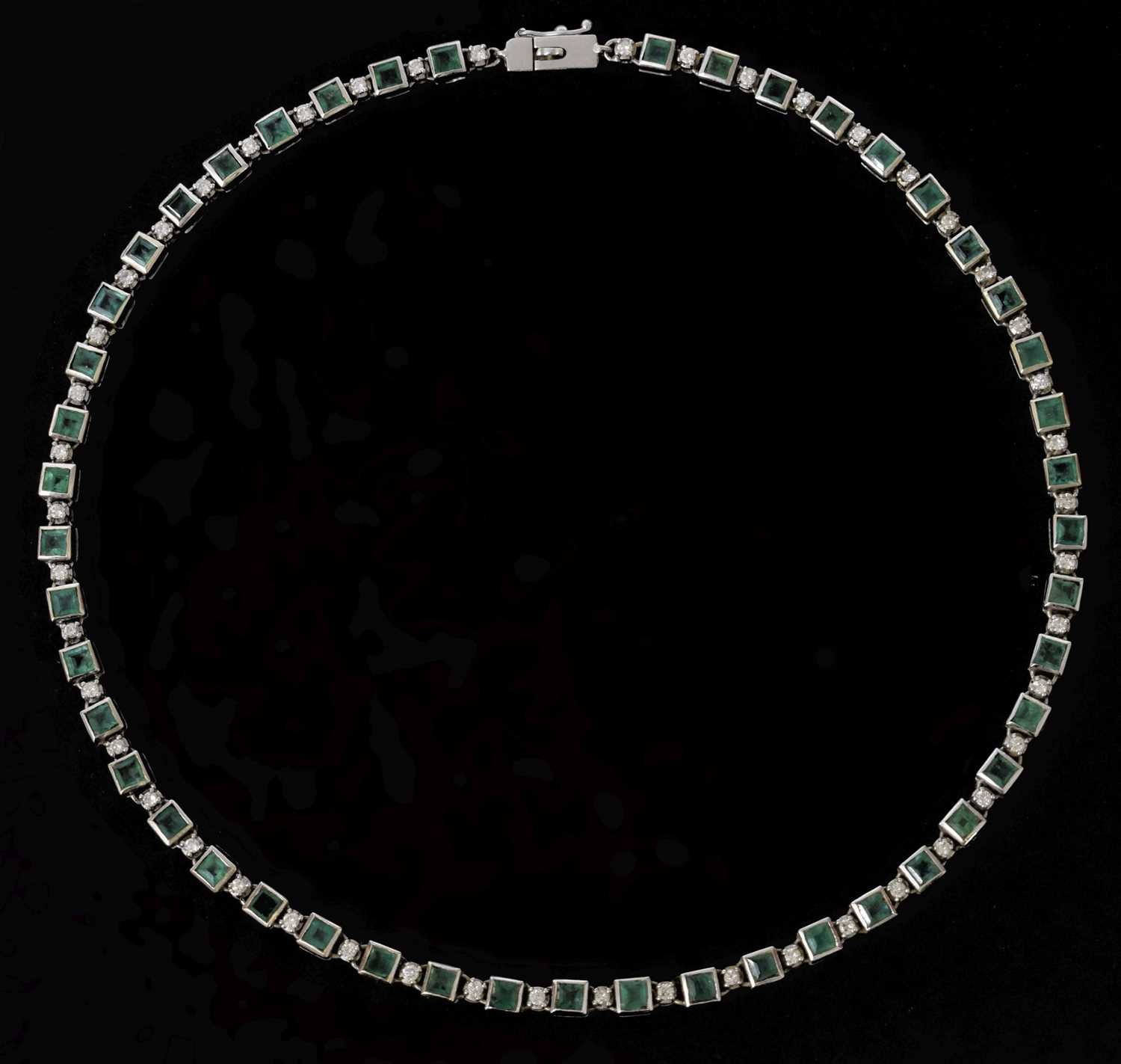 Lot 35 - Emerald and diamond 18ct white gold 'tennis' style necklace