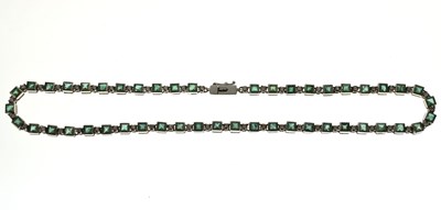Lot 35 - Emerald and diamond 18ct white gold 'tennis' style necklace