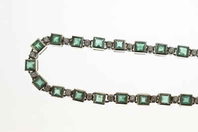 Lot 35 - Emerald and diamond 18ct white gold 'tennis' style necklace