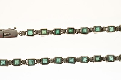 Lot 35 - Emerald and diamond 18ct white gold 'tennis' style necklace