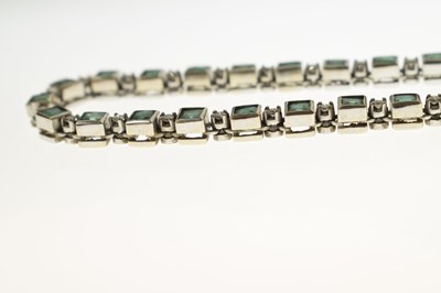 Lot 35 - Emerald and diamond 18ct white gold 'tennis' style necklace