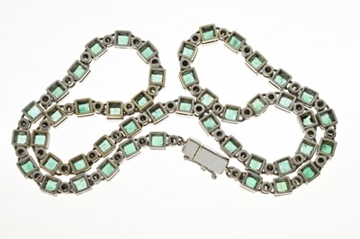 Lot 35 - Emerald and diamond 18ct white gold 'tennis' style necklace