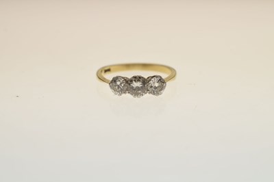 Lot 10 - 18ct gold and three stone diamond ring
