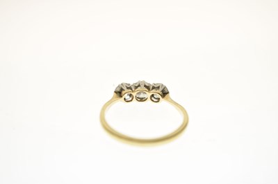 Lot 10 - 18ct gold and three stone diamond ring