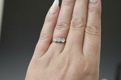 Lot 10 - 18ct gold and three stone diamond ring