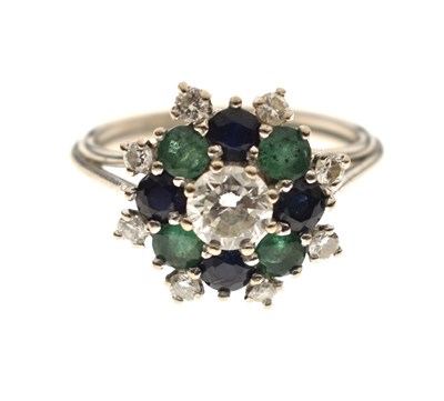 Lot 17 - Diamond, sapphire and emerald unmarked white metal cluster ring