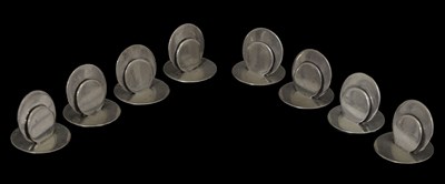 Lot 75 - Eight Edwardian silver menu holders of plain circular form