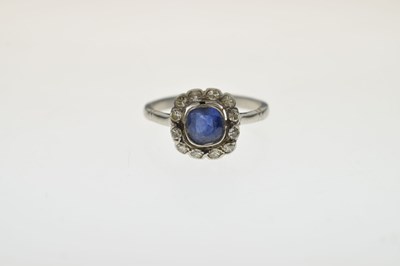 Lot 18 - Sapphire and diamond platinum cluster ring