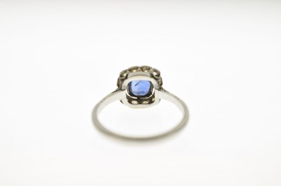 Lot 18 - Sapphire and diamond platinum cluster ring