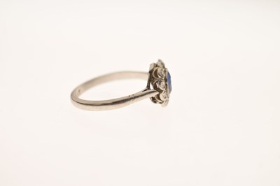 Lot 18 - Sapphire and diamond platinum cluster ring