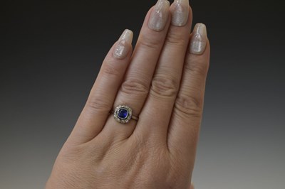 Lot 18 - Sapphire and diamond platinum cluster ring