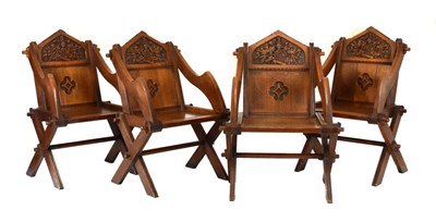 Lot 575 - Set of four craftsman-made carved oak 'Glastonbury' chairs