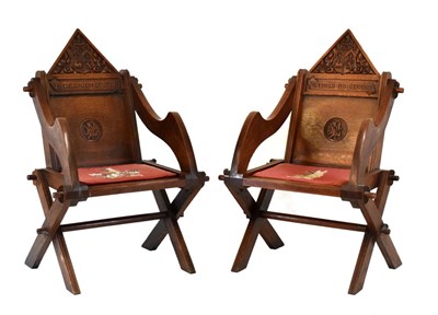 Lot 573 - Pair of Glastonbury type carved oak hall chairs