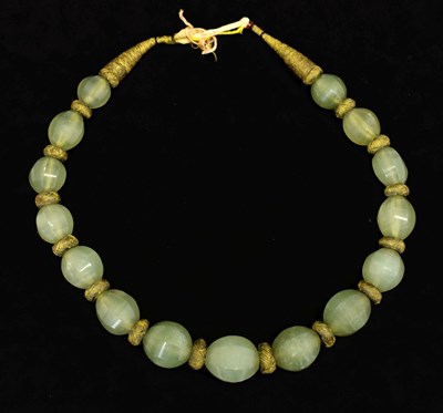 Lot 244 - Chinese celadon jade bead necklace
