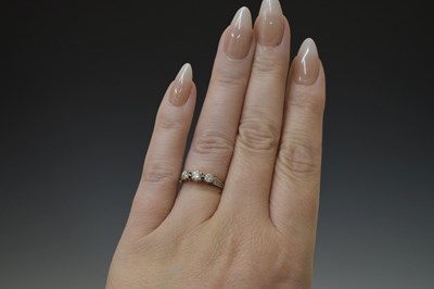 Lot 8 - Diamond yellow gold three-stone diamond ring