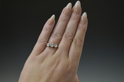 Lot 9 - Diamond 18ct yellow and white gold set three-stone ring