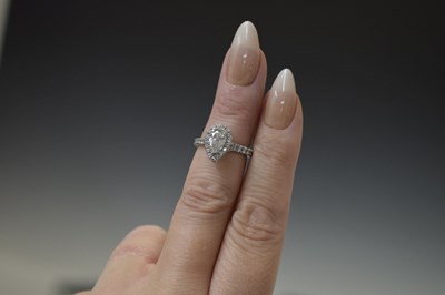 Lot 6 - Diamond pear shaped platinum halo ring with certificate
