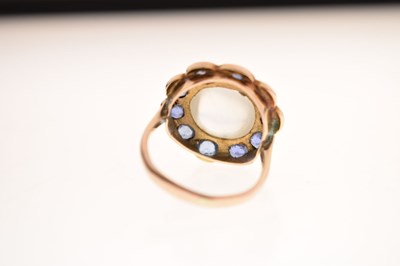 Lot 23 - Moonstone and sapphire 9ct gold cluster ring