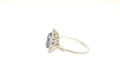Lot 20 - Sapphire and diamond platinum cluster ring