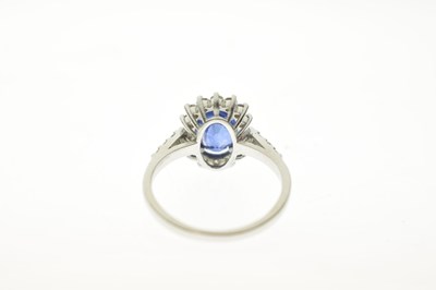 Lot 20 - Sapphire and diamond platinum cluster ring